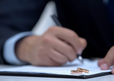 lawyer writing nuptial agreement